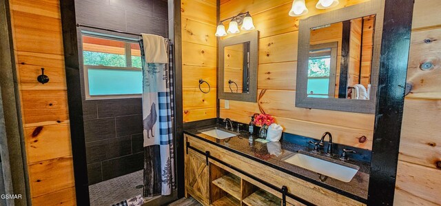 1531 Bear Valley Rd, Sevierville, TN 37876 - full bathroom featuring a shower stall, double vanity, and wood walls