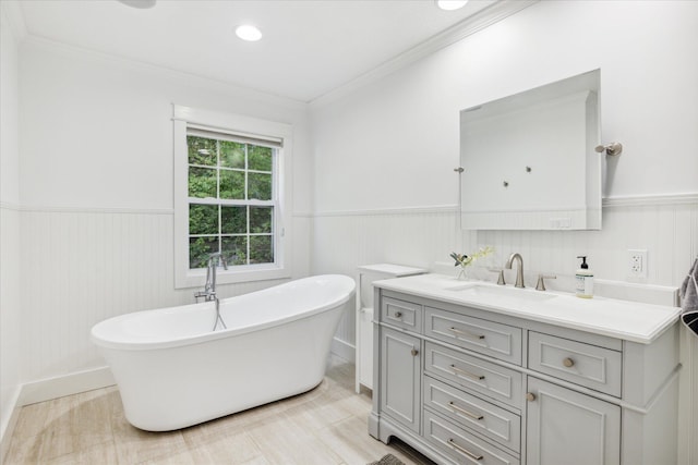 bathroom featuring a washtub and vanity