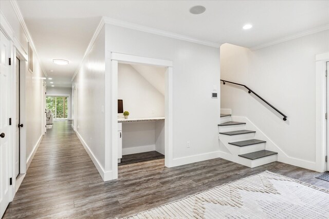 interior space with crown molding and dark hardwood / wood-style floors