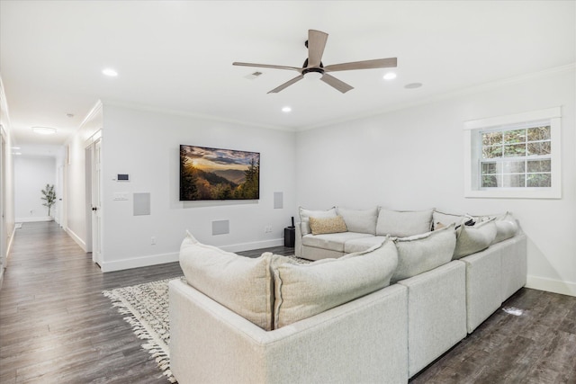 living room featuring dark hardwood / wood-style floors, ceiling fan, and ornamental molding