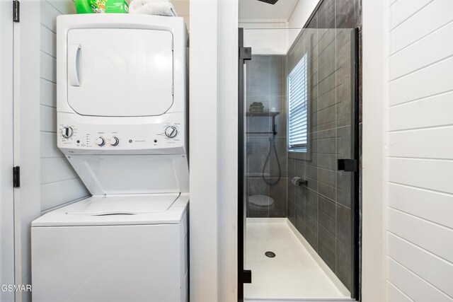 laundry area featuring stacked washer and clothes dryer