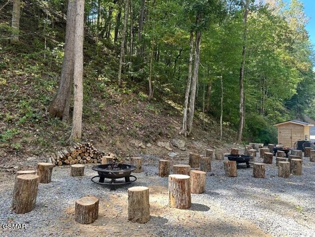 view of patio / terrace featuring a fire pit