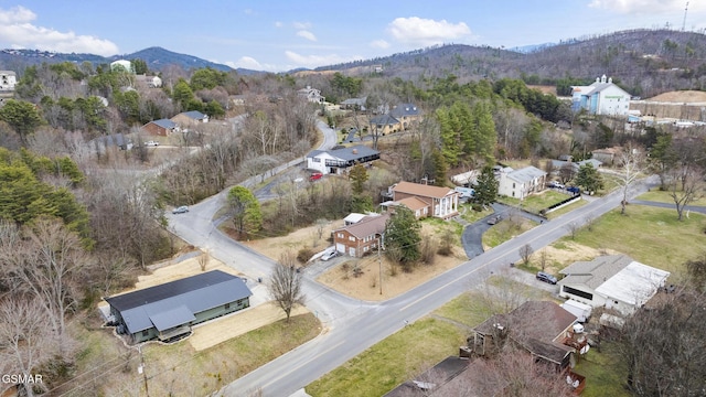 birds eye view of property featuring a mountain view