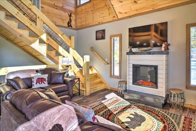 living room with high vaulted ceiling, wood ceiling, and hardwood / wood-style flooring