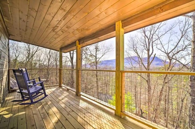 wooden deck featuring a mountain view