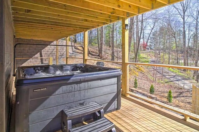 sunroom / solarium featuring plenty of natural light and a hot tub