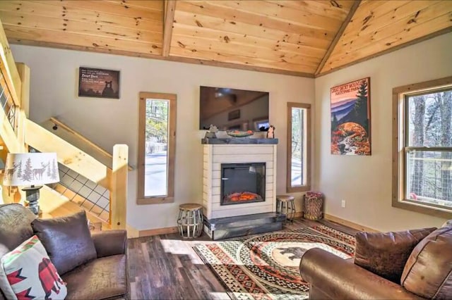 living room with plenty of natural light, wood ceiling, lofted ceiling, and hardwood / wood-style flooring