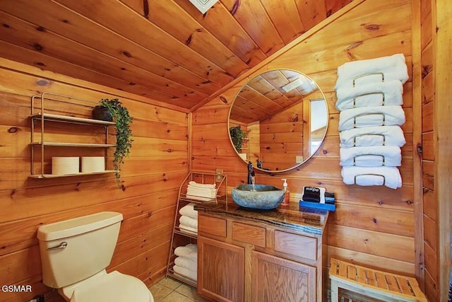 bathroom featuring tile patterned flooring, vaulted ceiling, wood walls, wooden ceiling, and toilet