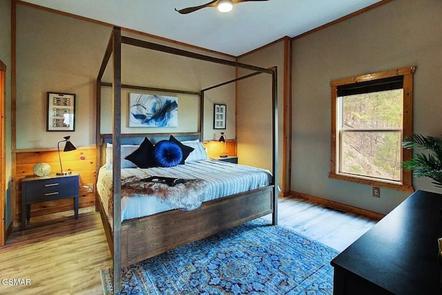 bedroom featuring light wood-type flooring and ceiling fan