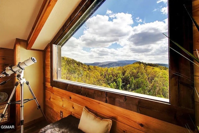 interior space with a wooded view