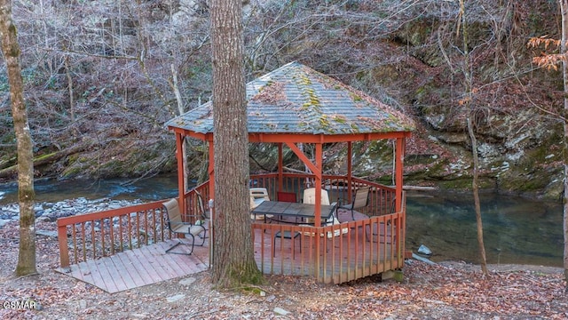 view of outbuilding featuring a water view and a gazebo