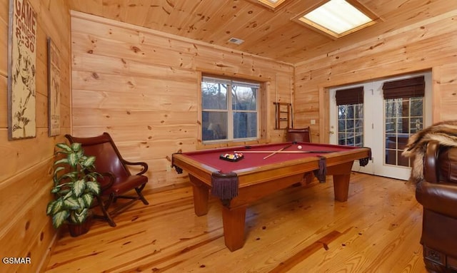 game room with pool table, wood walls, wooden ceiling, and light wood-style flooring