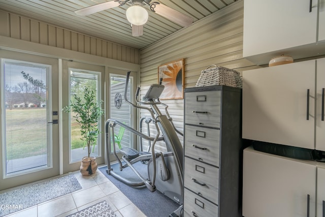 workout area featuring light tile patterned flooring and ceiling fan