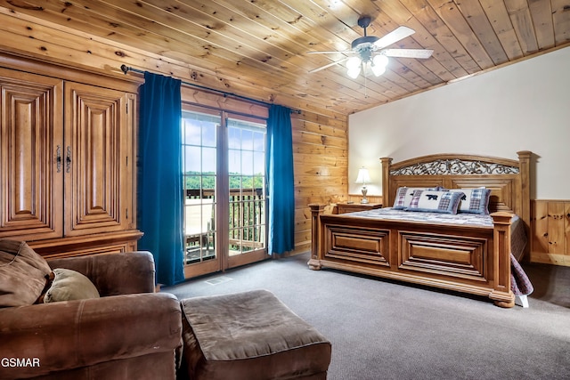 415 Big Bear Way, Pigeon Forge, TN 37863 - bedroom featuring access to exterior, wooden walls, carpet flooring, wooden ceiling, and wainscoting