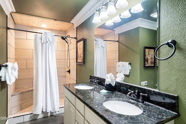 415 Big Bear Way, Pigeon Forge, TN 37863 - bathroom with a textured wall, tiled shower, wood finished floors, double vanity, and ornamental molding