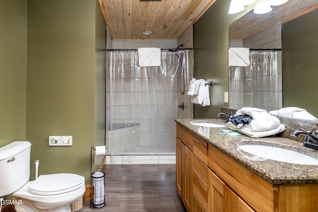 415 Big Bear Way, Pigeon Forge, TN 37863 - full bathroom with a tile shower, double vanity, wood finished floors, and wooden ceiling