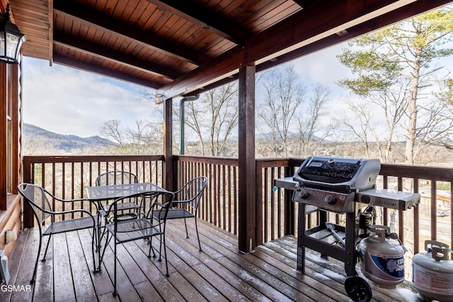 415 Big Bear Way, Pigeon Forge, TN 37863 - wooden terrace with area for grilling, outdoor dining area, and a mountain view