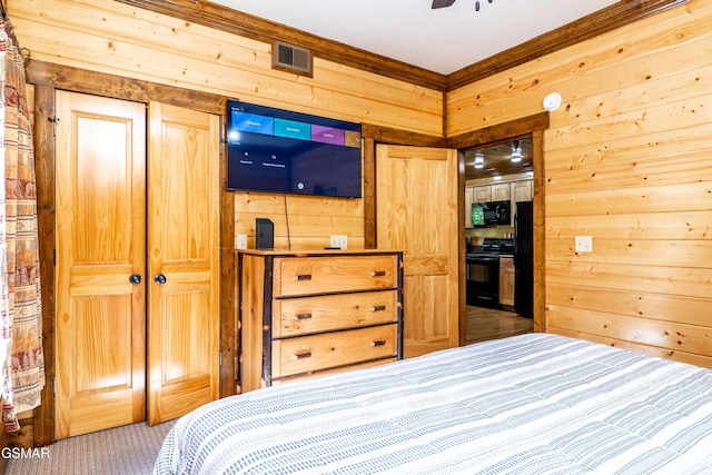 415 Big Bear Way, Pigeon Forge, TN 37863 - bedroom with wood walls and carpet floors