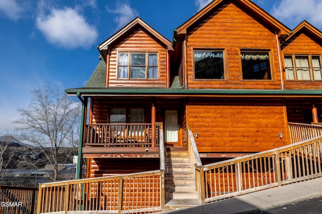 415 Big Bear Way, Pigeon Forge, TN 37863 - cabin with stairs, covered porch, and log veneer siding