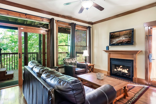 415 Big Bear Way, Pigeon Forge, TN 37863 - living room featuring a ceiling fan, a fireplace, wood finished floors, and ornamental molding