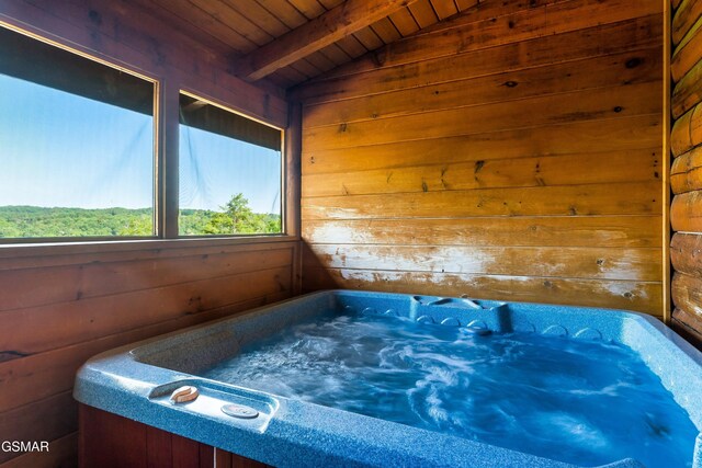 415 Big Bear Way, Pigeon Forge, TN 37863 - misc room with a wood ceiling with exposed beams, wooden walls, and a hot tub
