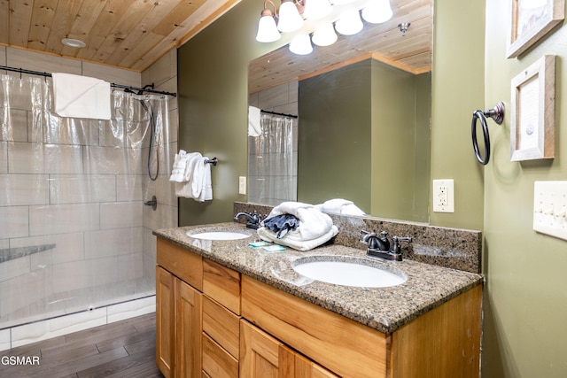 415 Big Bear Way, Pigeon Forge, TN 37863 - full bathroom featuring wood finished floors, a tile shower, double vanity, and wooden ceiling