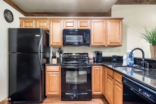 415 Big Bear Way, Pigeon Forge, TN 37863 - kitchen with black appliances, dark stone counters, and light wood-style flooring
