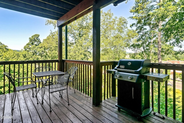 415 Big Bear Way, Pigeon Forge, TN 37863 - wooden terrace featuring grilling area and outdoor dining space