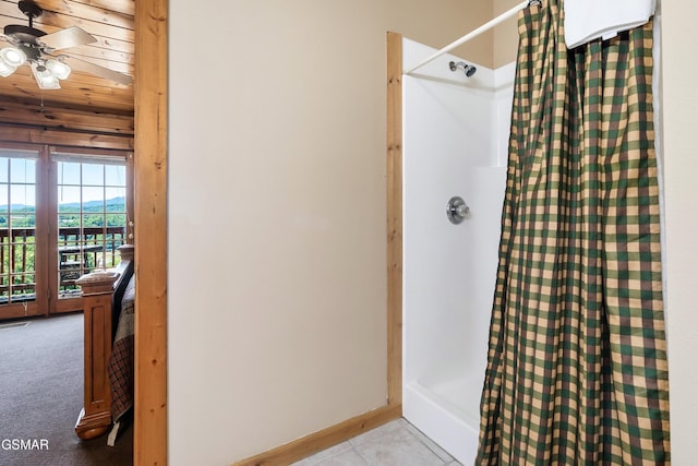 415 Big Bear Way, Pigeon Forge, TN 37863 - bathroom with a shower with shower curtain, a ceiling fan, and tile patterned flooring