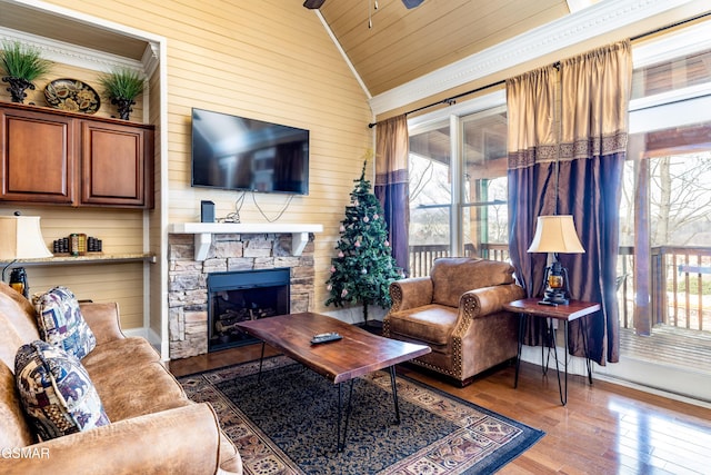 415 Big Bear Way, Pigeon Forge, TN 37863 - living area featuring lofted ceiling, healthy amount of natural light, hardwood / wood-style flooring, a ceiling fan, and wood walls