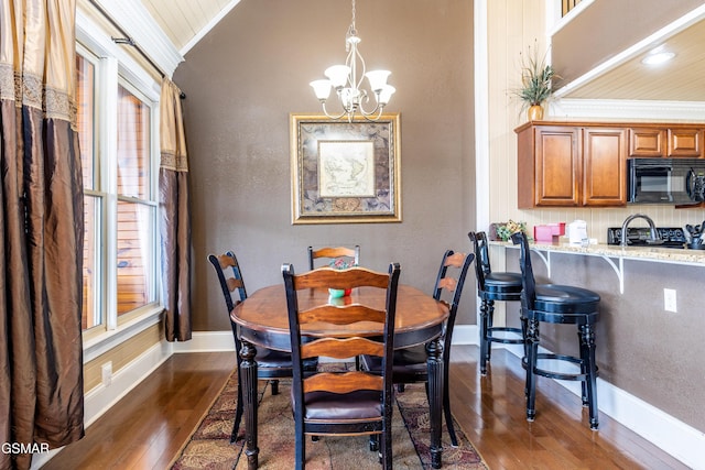 415 Big Bear Way, Pigeon Forge, TN 37863 - dining room featuring dark wood finished floors, a chandelier, and vaulted ceiling