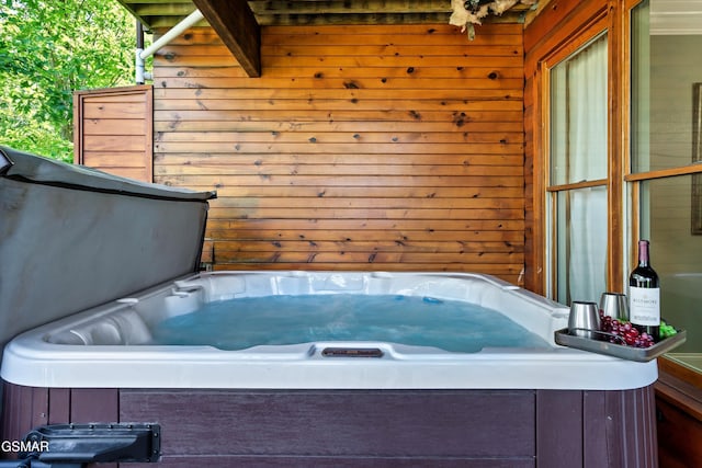 415 Big Bear Way, Pigeon Forge, TN 37863 - bathroom featuring wood walls and a tub to relax in