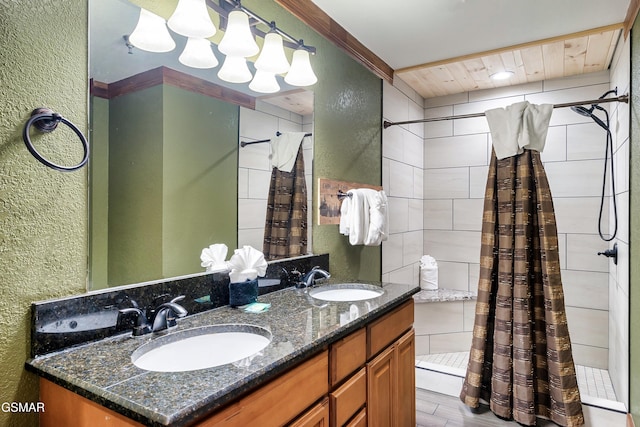 415 Big Bear Way, Pigeon Forge, TN 37863 - bathroom with a textured wall, a stall shower, and double vanity