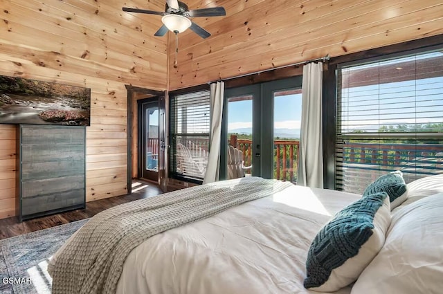 668 Stockton Dr, Sevierville, TN 37876 - bedroom with access to outside, wooden walls, wood finished floors, french doors, and multiple windows