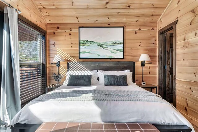 668 Stockton Dr, Sevierville, TN 37876 - bedroom with wooden walls, vaulted ceiling, and wood ceiling
