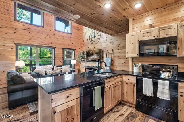 668 Stockton Dr, Sevierville, TN 37876 - kitchen with black appliances, wooden walls, a peninsula, light brown cabinets, and wood ceiling