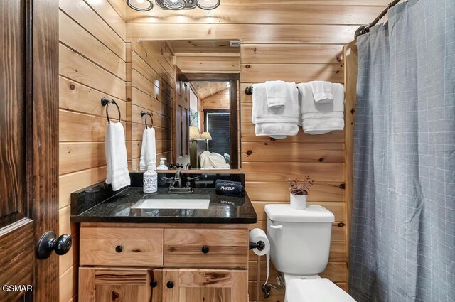 668 Stockton Dr, Sevierville, TN 37876 - bathroom with wood walls, vanity, and curtained shower