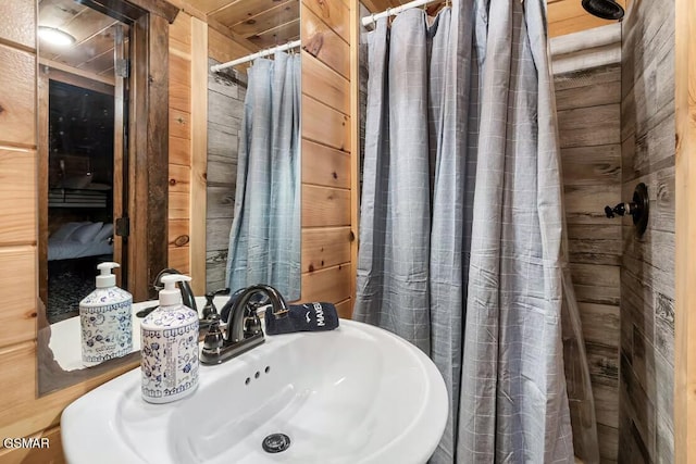 668 Stockton Dr, Sevierville, TN 37876 - full bathroom with wood walls and tiled shower