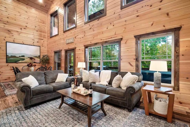 668 Stockton Dr, Sevierville, TN 37876 - living area featuring wooden walls, a towering ceiling, and wood finished floors