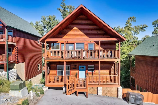 668 Stockton Dr, Sevierville, TN 37876 - log cabin with faux log siding and a balcony