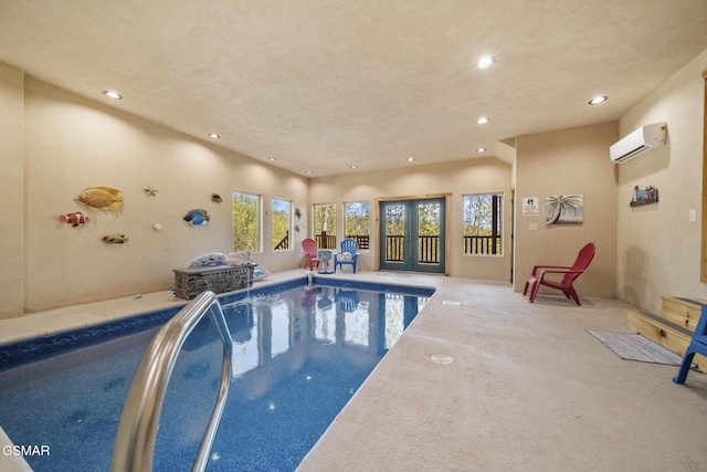 indoor pool featuring an AC wall unit and french doors