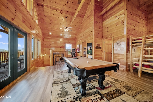 recreation room with wooden walls, pool table, wood ceiling, light wood-type flooring, and french doors