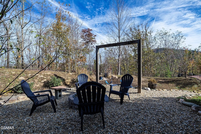 view of patio / terrace with an outdoor fire pit