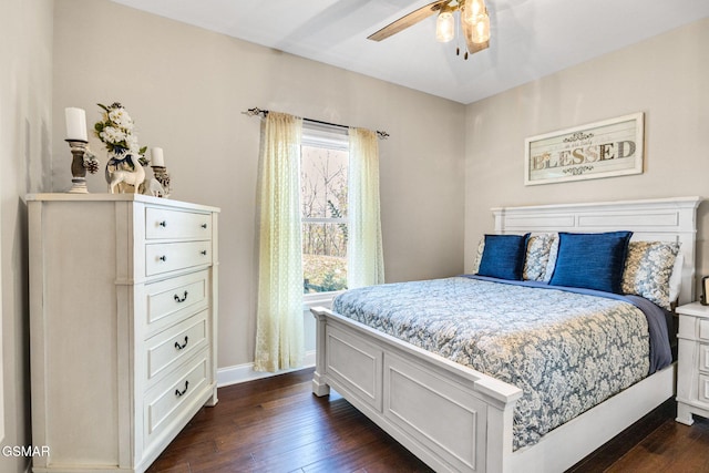 bedroom featuring dark hardwood / wood-style flooring and ceiling fan