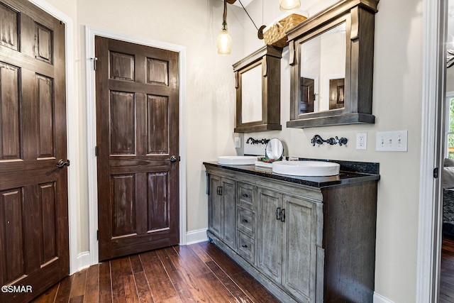 bathroom featuring wood-type flooring and vanity