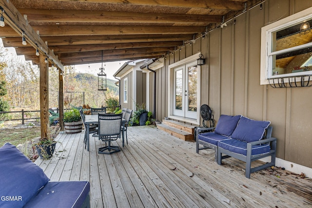 deck with french doors and an outdoor hangout area