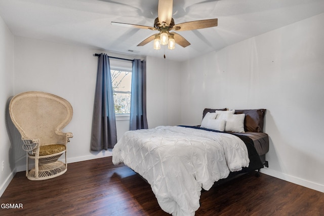 bedroom with ceiling fan and dark wood-type flooring