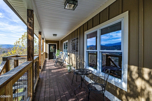 wooden deck featuring a mountain view