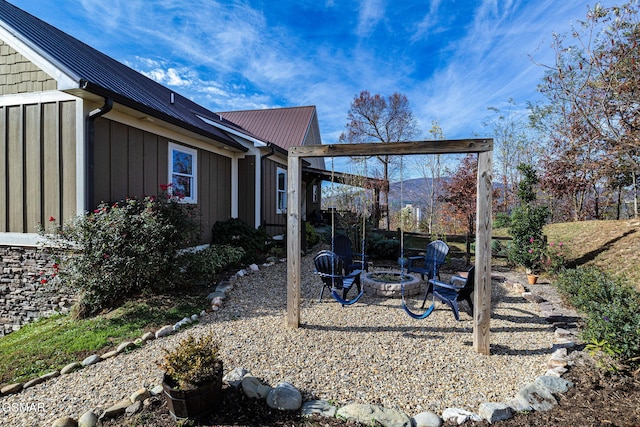 view of yard with an outdoor fire pit