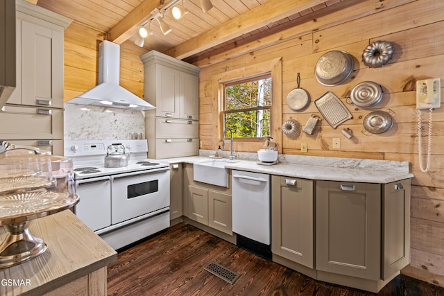 kitchen with gray cabinets, white appliances, wood walls, and extractor fan